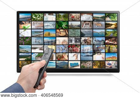 Online Tv, Streaming Vod Service Concept. Male Hand Holding Tv Remote Control. Television Streaming 