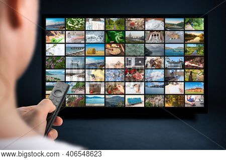 Person Holds Remote Control. Vod Content Provider Concept. Television Streaming Video Concept. Media