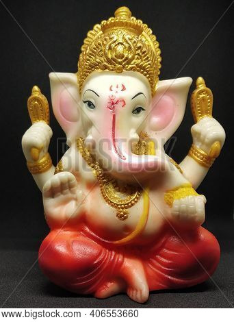 Statue Of Hindu Idol Ganesha Selectively Focused With Black Background.