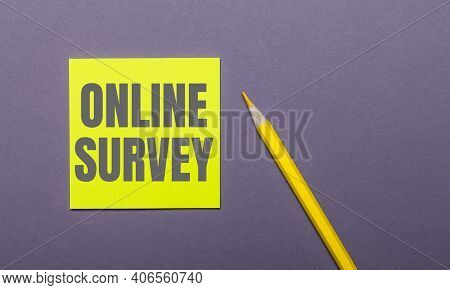 On A Gray Background, A Bright Yellow Pencil And A Yellow Sticker With The Words Online Suvey