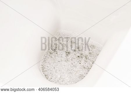 Close-up Of Toilet Bowl, Toilet. Lavatory Pan In The Bathroom. Restroom. The View From The Top.