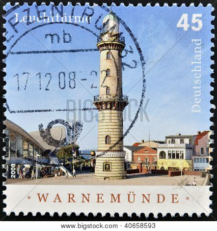 A stamp printed in Germany shows Warnemunde lighthouse