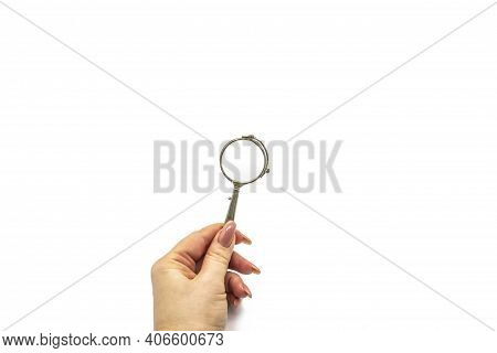 Hand Hold An Old Vintage Lorgnette From The Middle Of The Nineteenth Century On The White Background