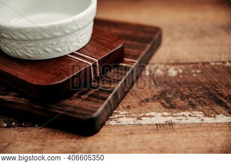 Set Of Wooden Cuttng Boads On Wooden Background. Wooden Kitchen Block Close Up.