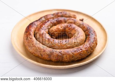 Northern Thai Sausage (sai Aua), Grilled Intestine Stuffed With Minced Pork, Spices And Herbs On Whi