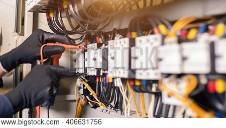 Electrician Engineer Work Tester Measuring Voltage And Current Of Power Electric Line In Electical C