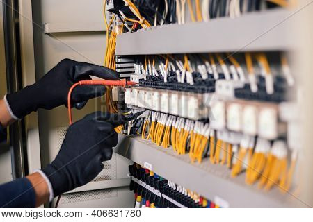 Electrician Engineer Work Tester Measuring Voltage And Current Of Power Electric Line In Electical C