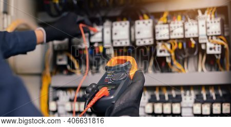 Electrician Engineer Work Tester Measuring Voltage And Current Of Power Electric Line In Electical C