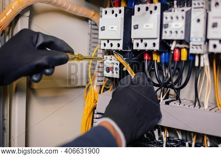 Electrician Engineer Work Tester Measuring Voltage And Current Of Power Electric Line In Electical C