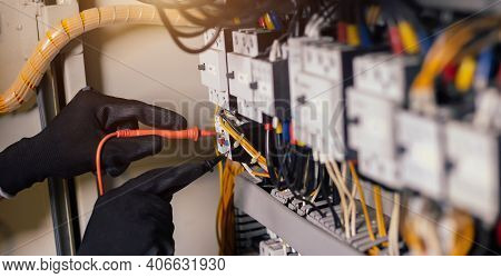 Electrician Engineer Work Tester Measuring Voltage And Current Of Power Electric Line In Electical C