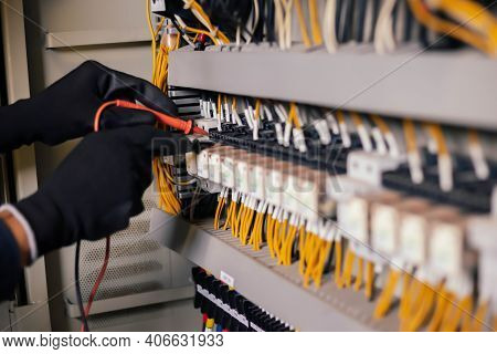 Electrician Engineer Work Tester Measuring Voltage And Current Of Power Electric Line In Electical C