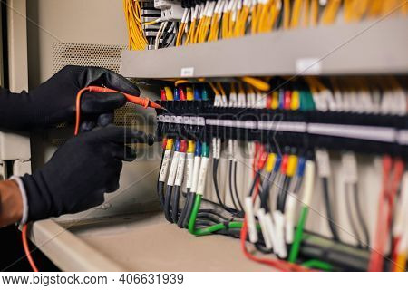 Electrician Engineer Work Tester Measuring Voltage And Current Of Power Electric Line In Electical C