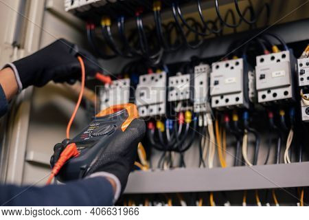 Electrician Engineer Work Tester Measuring Voltage And Current Of Power Electric Line In Electical C