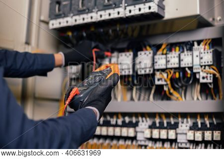 Electrician Engineer Work Tester Measuring Voltage And Current Of Power Electric Line In Electical C
