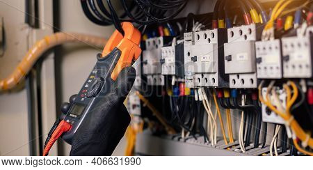 Electrician Engineer Work Tester Measuring Voltage And Current Of Power Electric Line In Electical C