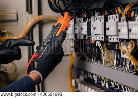 Electrician Engineer Work Tester Measuring Voltage And Current Of Power Electric Line In Electical C