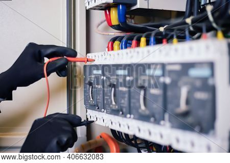 Electrician Engineer Work Tester Measuring Voltage And Current Of Power Electric Line In Electical C