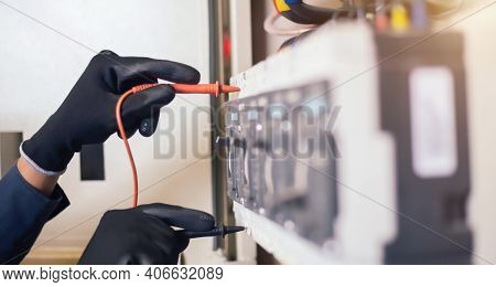 Electrician Engineer Work Tester Measuring Voltage And Current Of Power Electric Line In Electical C