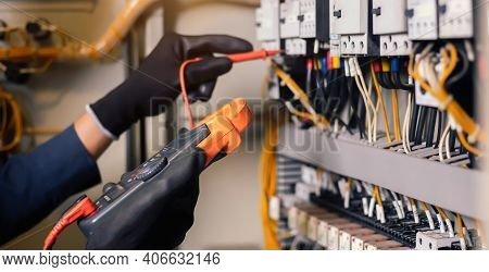 Electrician Engineer Work Tester Measuring Voltage And Current Of Power Electric Line In Electical C