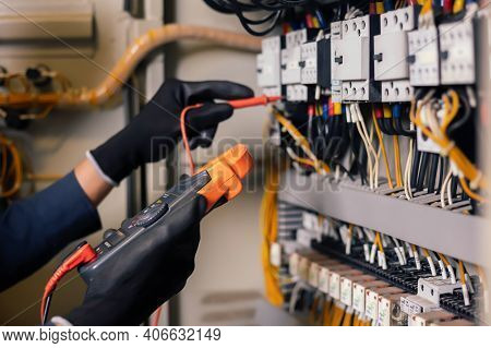 Electrician Engineer Work Tester Measuring Voltage And Current Of Power Electric Line In Electical C
