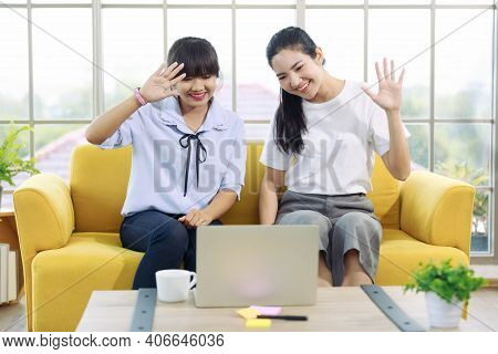 Young And Beautiful Asain Woman Talk To Someone On A Notebook Computer Screen With Hand Sign, Deaf L