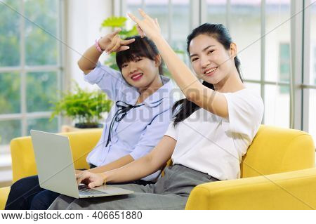Young And Beautiful Asain Woman Talk To Someone On A Notebook Computer Screen With Hand Sign, Deaf L
