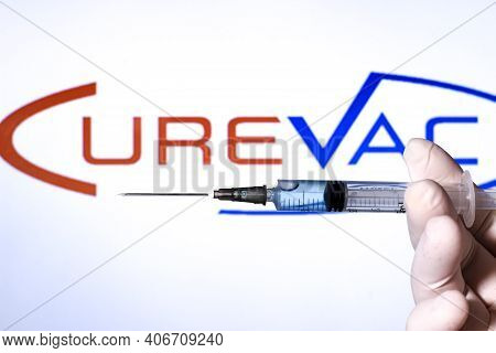 Madrid, Spain- February 3, 2020: Hand On White Surgery Glove Holding Syringe With Covid Vaccine. In 