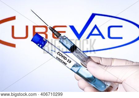 Madrid, Spain- February 3, 2020: Hand On White Surgery Glove Holding Syringe With Covid Vaccine. In 