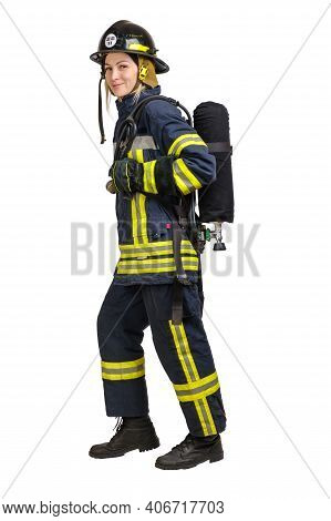 Full Body Young Caucasian Woman In Uniform Of Fireman Goes Away In Profile With Air Cylinder Assembl