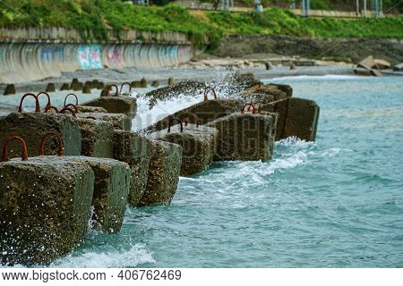Breakwater On Beach. Ocean Beach Breakwaters. Old Concrete Blocks Campi.