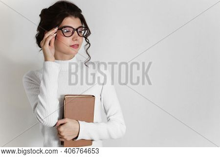 A Young Woman With Poor Eyesight In Glasses Squints, Glasses For Vision With Diopters. Deterioration