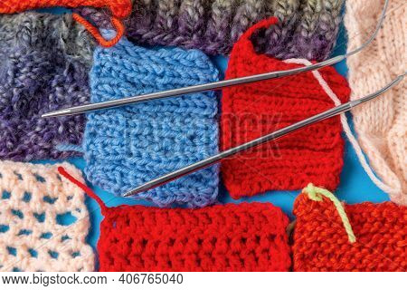 Knitting Needles And Fragments Of Colored Knitted Patterns. Diy Knitting