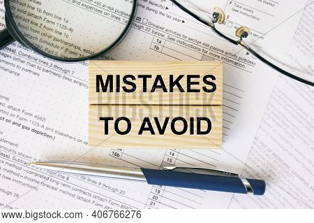 Wooden Blocks With Text Mistakes To Avoid On Financial Docs