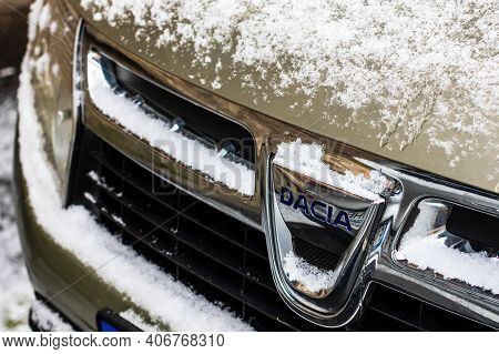 Car Logo Dacia Covered With Snow Close Up. Snow On Dacia Duster In Bucharest, Romania, 2021