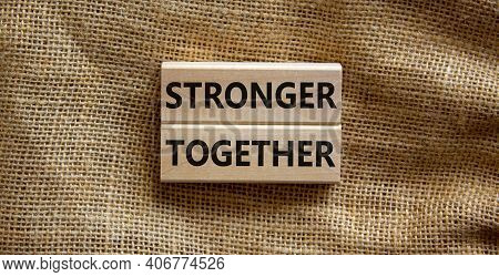 Stronger Together Symbol. Concept Words 'stronger Together' On Wooden Blocks On A Beautiful Canvas B