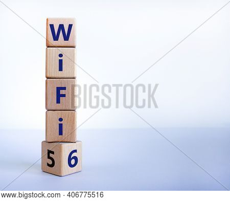 Wifi 5 Or 6 Symbol. Turned A Wooden Cube And Changed The Words Wifi 5 To Wifi 6. Beautiful White Bac