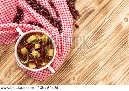 Red Bean Soup With Potatoes, Tomatoes And Paprika In A Ceramic Bowl. Top View.