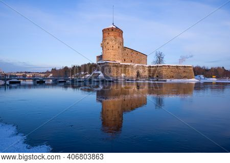 View Of The Old Fortress Olavinlinna (olafsborg) On A Sunny March Evening. Savonlinna, Finland