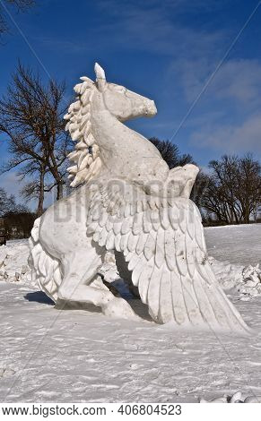 Moorhead, Minnesota, February 4, 2021: A Norwegian Mythological  Pegsaus Creature Is Carved During T