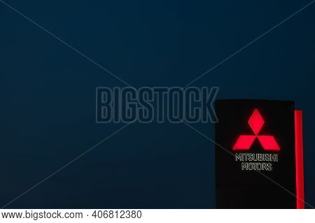 Chelyabinsk, Russia - September 29, 2020: Mitsubishi Motor Company Brand Logo On The Stand At Night 