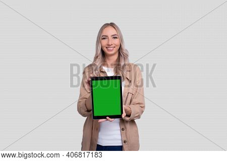 Girl Showing Tablet Green Screen Standing Isolated. Commecial, Shopping, Advertisment Concept