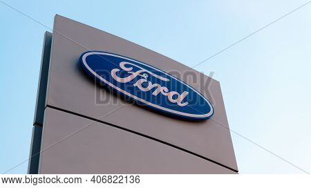 Chelyabinsk, Russia - September 29, 2020: Ford  Company Brand Logo On The Stand Against The Blue Sky