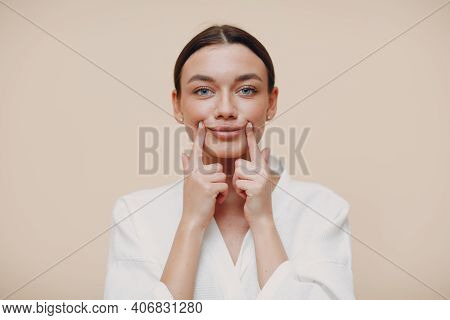 Young Woman Doing Face Building Facial Gymnastics Self Massage And Rejuvenating Exercises
