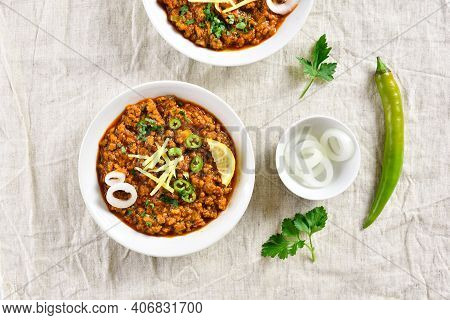 Keema Curry In Bowl Over Light Background. Indian And Pakistani Style Dish. Top View, Flat Lay