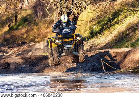 Afipsip, Russia - October 31, 2020: Sportsman On Quad Bike Jumping In Deep Water At Mud Racing Conte