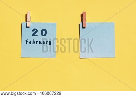 20st Of February. 20st Day Of The Month, Calendar Date. Two Blue Sheets For Writing On A Yellow Back