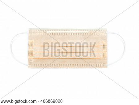 Orange Protective Face Mask. Disposable Medical Face Mask Isolated On White Background Closeup. Covi