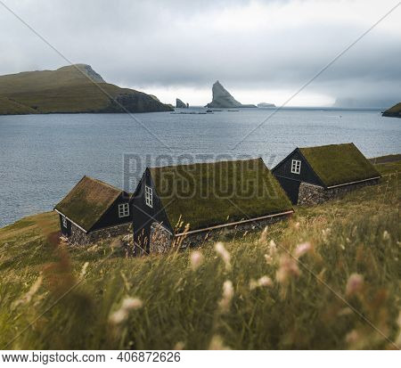 Bour Village Grass-covered Picturesque Houses At The Faroese Coastline In The Village Bour With View
