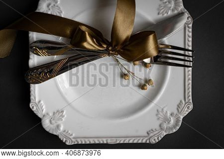 Romantic Tabble Setting With Ribbon, Plates, Cutlery On Black Background. Empty Plate. Mockup Design