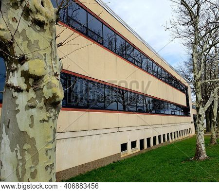 The Side Of A Two-story Office Building With Modern Design, Lined With Trees; Located In Glen Burnie